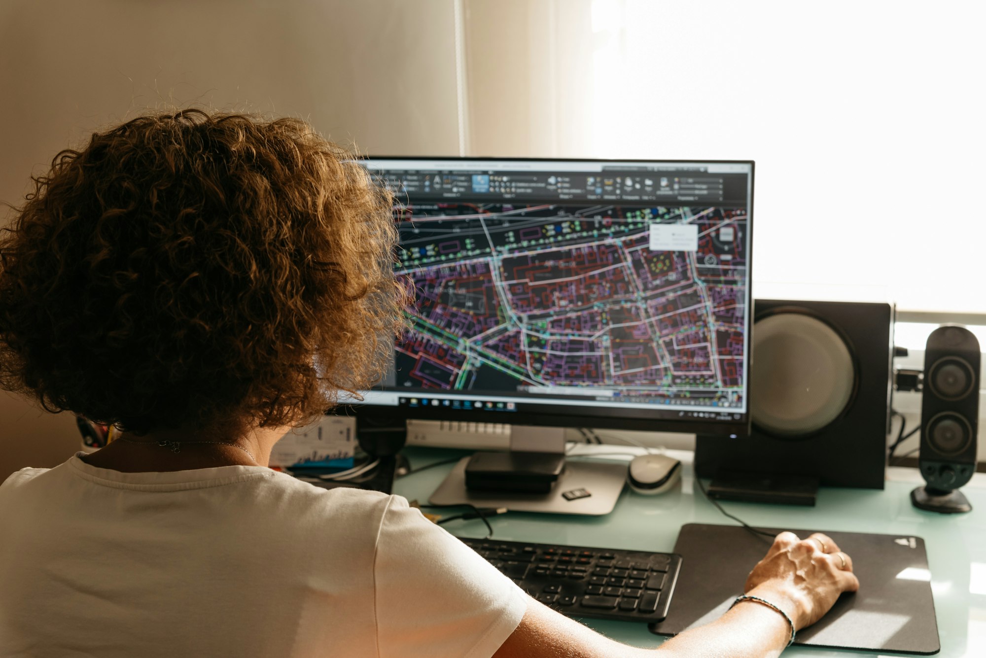 Architect female drawing with cad software BIM