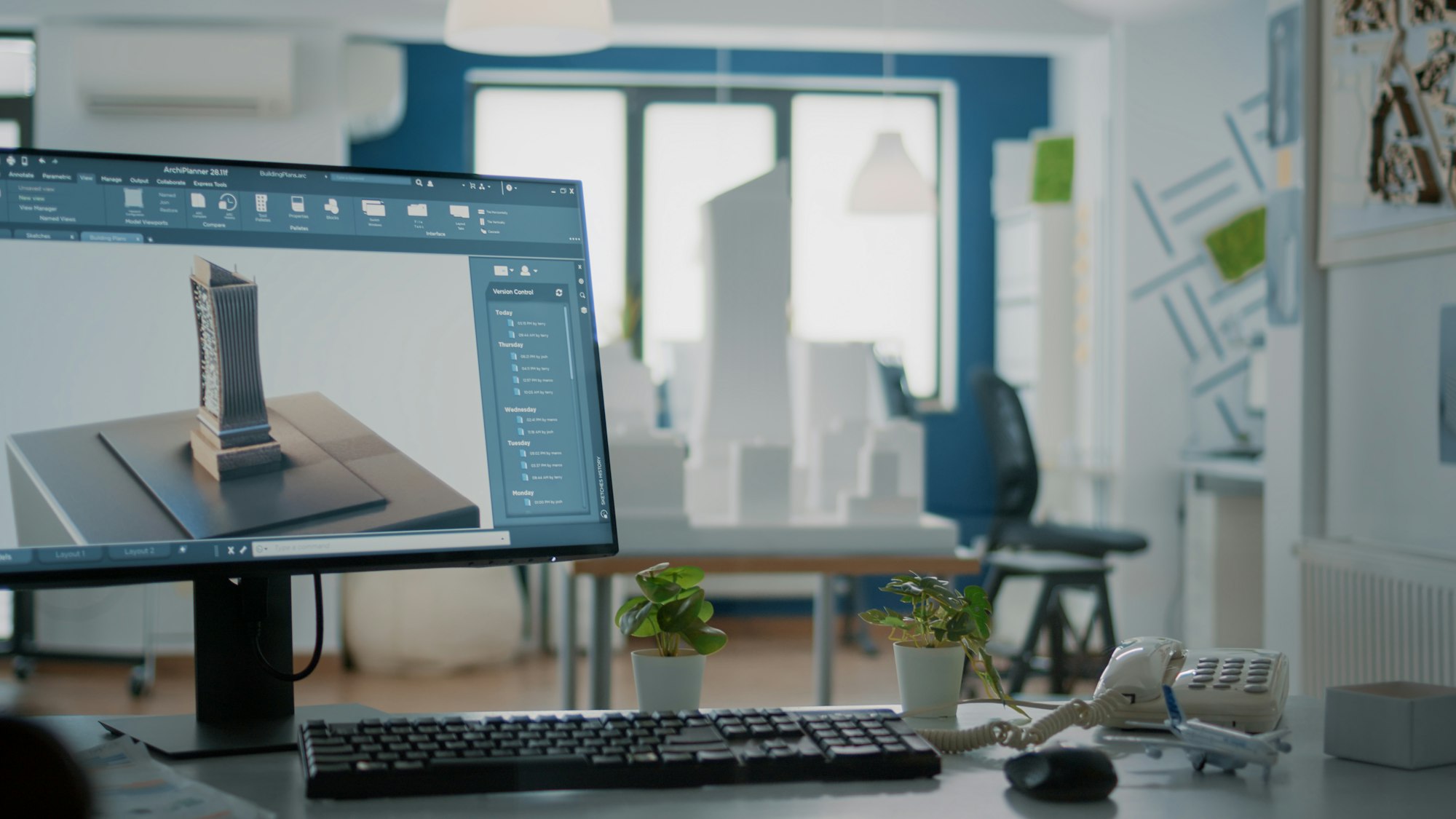 Close up of 3d building model on computer screen in empty office for architectural design